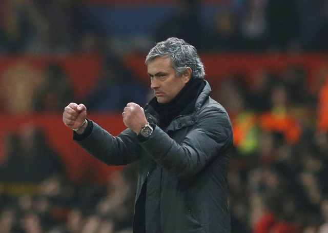 Real Madrid's coach Jose Mourinho reacts during the Champions League soccer match against Manchester United at Old Trafford stadium in Manchester, March 5, 2013. REUTERS/Phil Noble (BRITAIN - Tags: SPORT SOCCER)