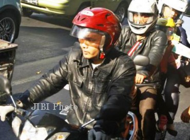 Pemudik bersepeda motor melintasi jalan Kota Solo pada musim mudik Lebaran 2012 lalu. (Dok Solopos)