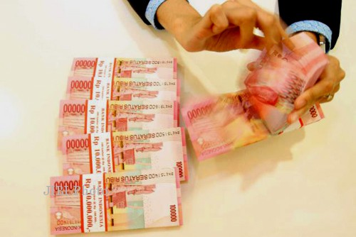 Ilustrasi uang tunai rupiah (JIBI/Bisnis)