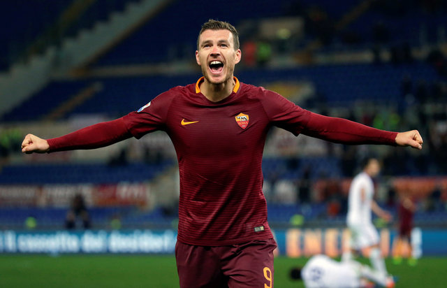 Edin Dzeko merayakan gol. (JIBI/REUTERS/Max Rossi)