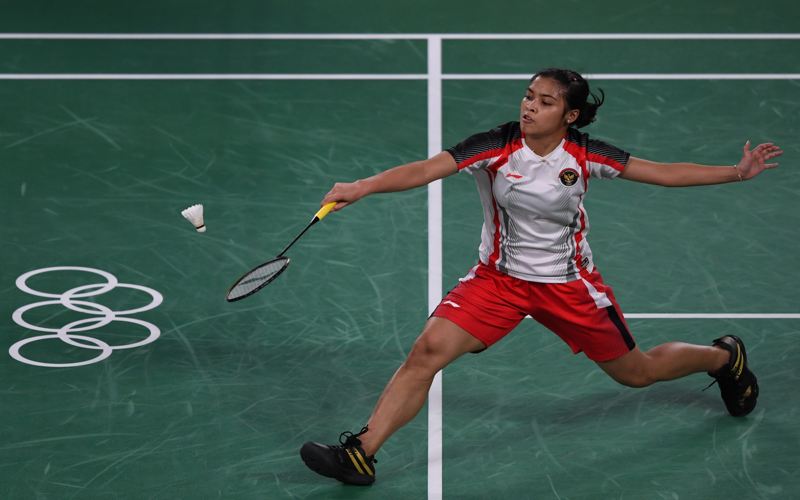 Tunggal putri Indonesia Gregoria Mariska Tunjung mengembalikan kok ke arah tunggal putri Belgia Lianne Tan dalam penyisihan Grup M Olimpiade Tokyo 2020 di Musashino Forest Sport Plaza, Tokyo, Jepang, Rabu (28/7/2021). (ANTARA FOTO/Sigid) Kurniawan/rwa