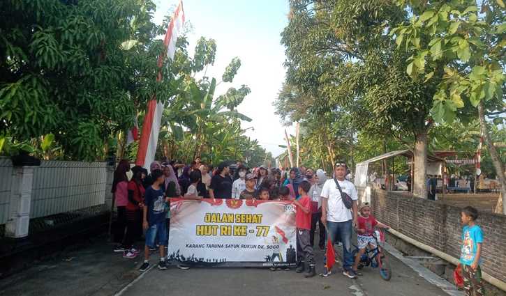 Sejumlah warga empat RT di Dukuh Sogo, Desa Bandung, Kecamatan Ngrampal, Sragen, menggelar jalan sehat untuk memeriahkan HUT ke-77 RI, Minggu (14/8/2022). (Istimewa/HendryMomon)